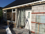 Nieuwe kozijnen voorgevel + slopen oude gevelbekleding